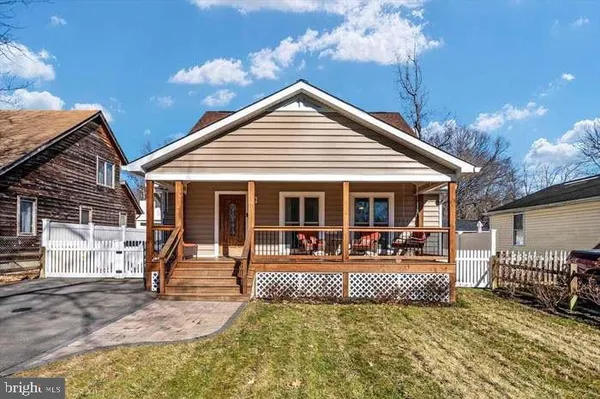 a front view of a house with a porch