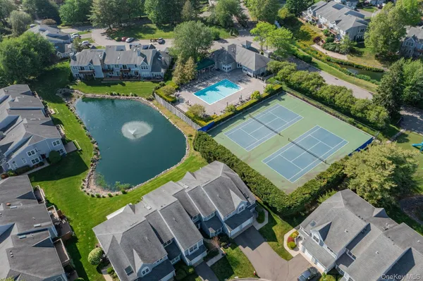 an aerial view of a house with outdoor space