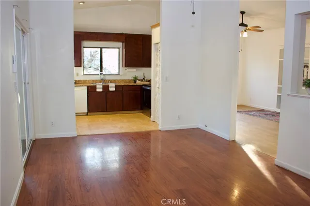 a view of a kitchen with a sink and a window