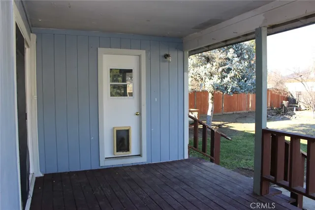 a view of a porch with wooden floor and outdoor space