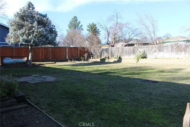 a backyard of apartments with large trees