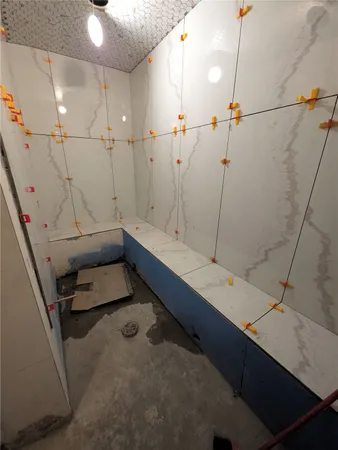 a bedroom with bed and flat screen tv