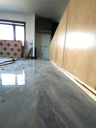 a bedroom with furniture and window