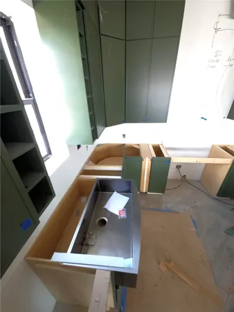 a bathroom with a tub sink and mirror