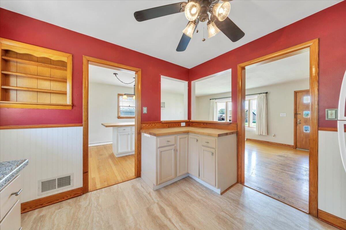 2515 Northminster Road Northwest Roanoke, VA 24012 - Photo 17 of 54 a view of a hallway with wooden floor and a kitchen