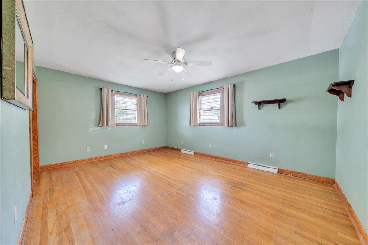 2515 Northminster Road Northwest Roanoke, VA 24012 - Photo 18 of 54 a view of an empty room with wooden floor and a window