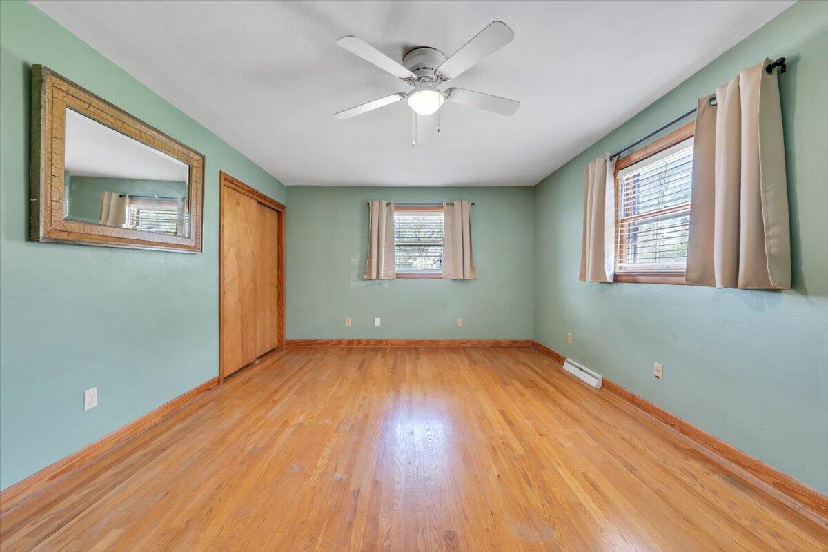 2515 Northminster Road Northwest Roanoke, VA 24012 - Photo 19 of 54 a view of an empty room with wooden floor and a window