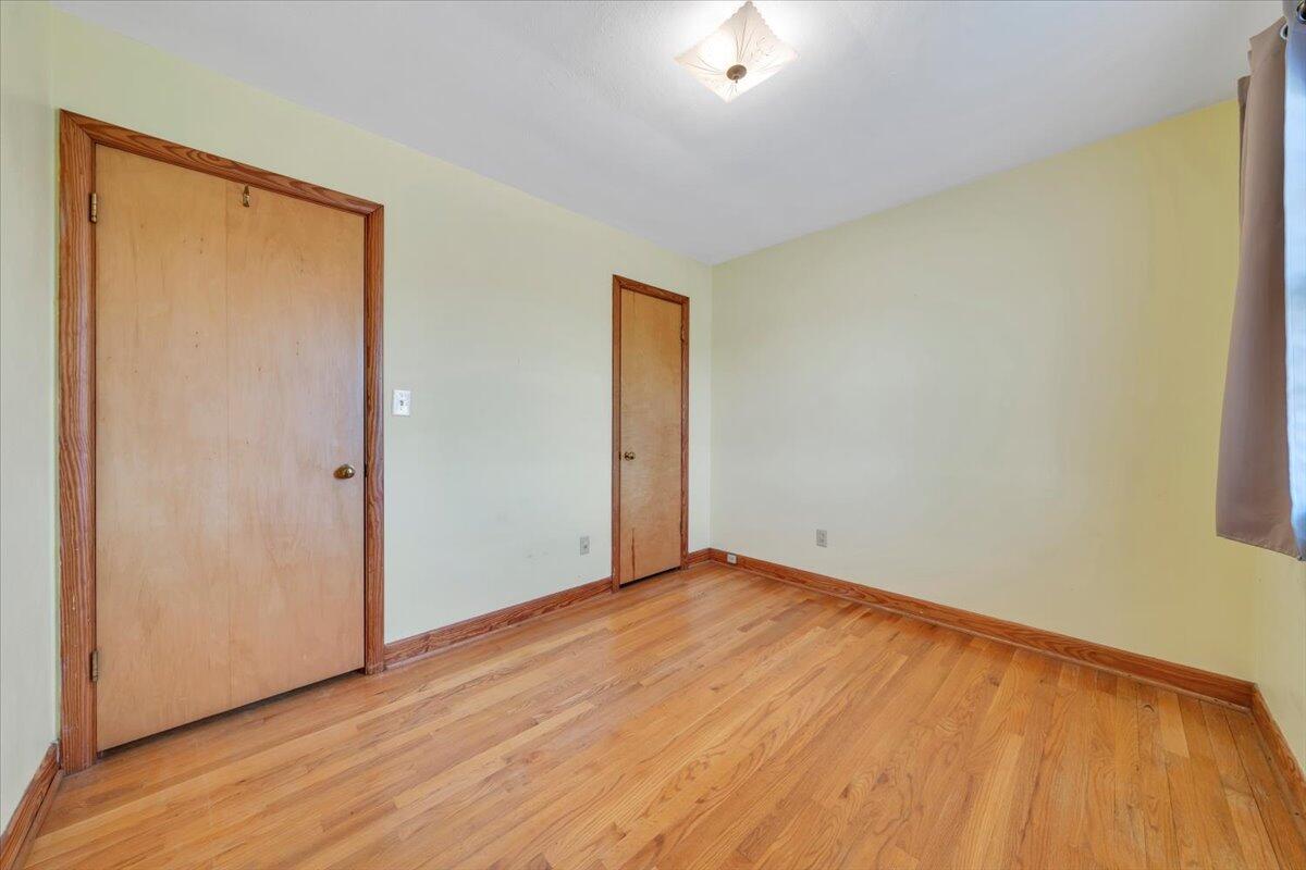 2515 Northminster Road Northwest Roanoke, VA 24012 - Photo 26 of 54 an empty room with wooden floor and closet