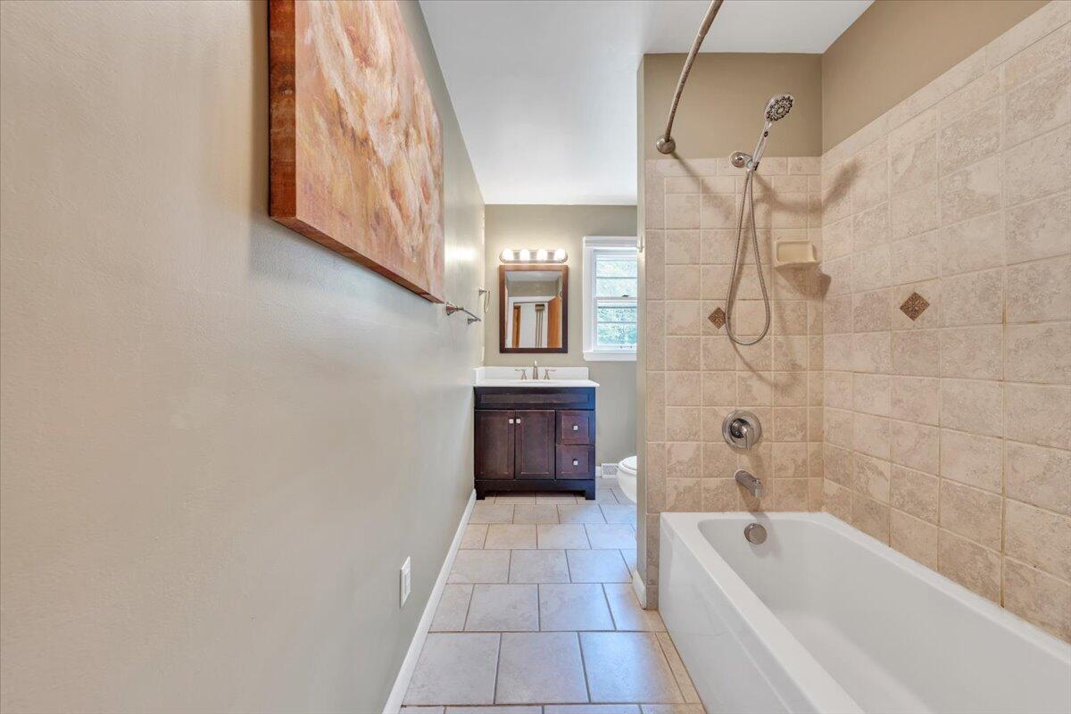 2515 Northminster Road Northwest Roanoke, VA 24012 - Photo 27 of 54 a bathroom with a bathtub and a shower