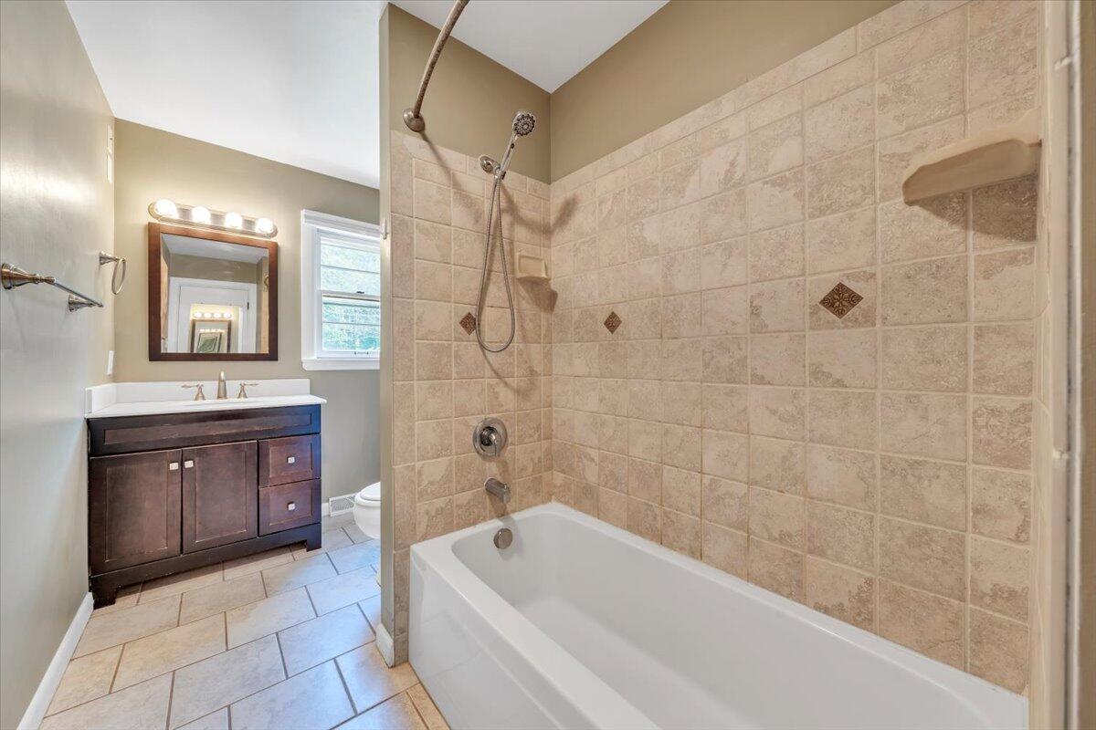 2515 Northminster Road Northwest Roanoke, VA 24012 - Photo 28 of 54 a spacious bathroom with a tub sink shower and mirror