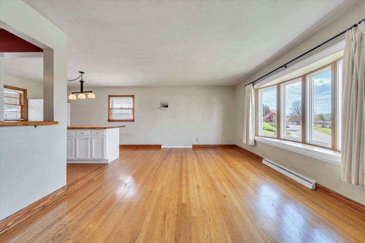 2515 Northminster Road Northwest Roanoke, VA 24012 - Photo 3 of 54 wooden floor in an empty room with a window