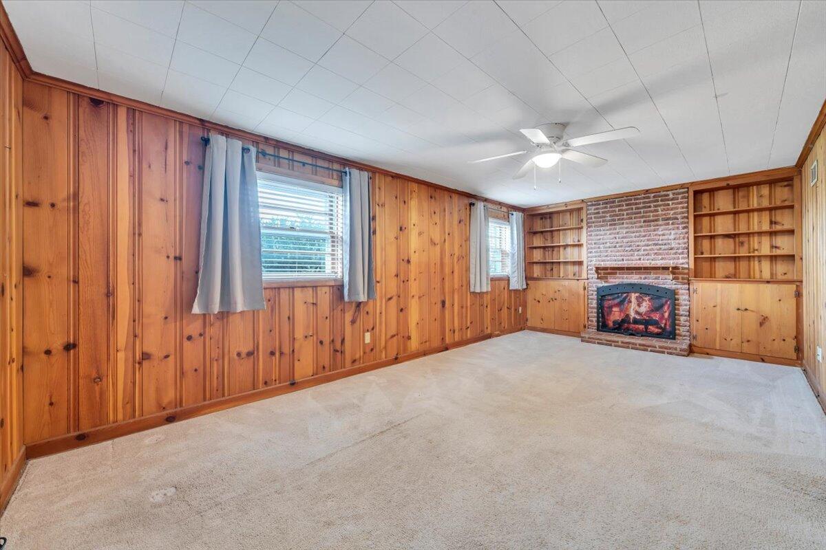 2515 Northminster Road Northwest Roanoke, VA 24012 - Photo 32 of 54 a view of an empty room with a fireplace and a window