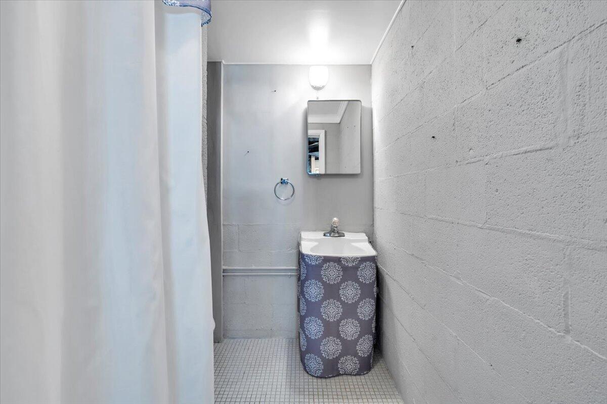 2515 Northminster Road Northwest Roanoke, VA 24012 - Photo 38 of 54 a bathroom with a sink and mirror