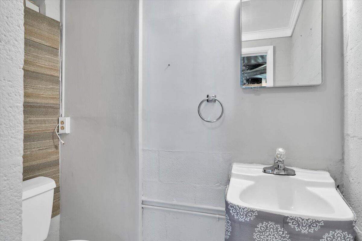 2515 Northminster Road Northwest Roanoke, VA 24012 - Photo 39 of 54 a bathroom with a sink a toilet and mirror