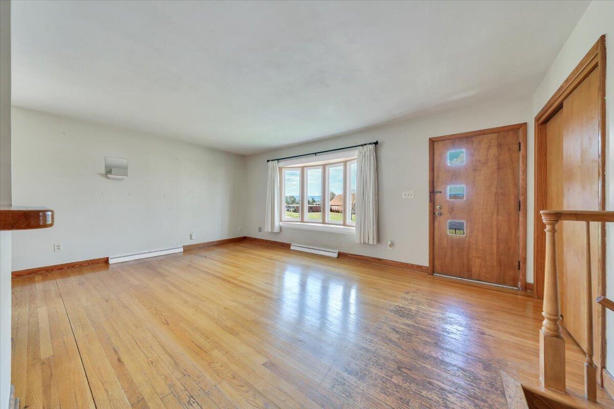 2515 Northminster Road Northwest Roanoke, VA 24012 - Photo 4 of 54 an empty room with wooden floor and a window