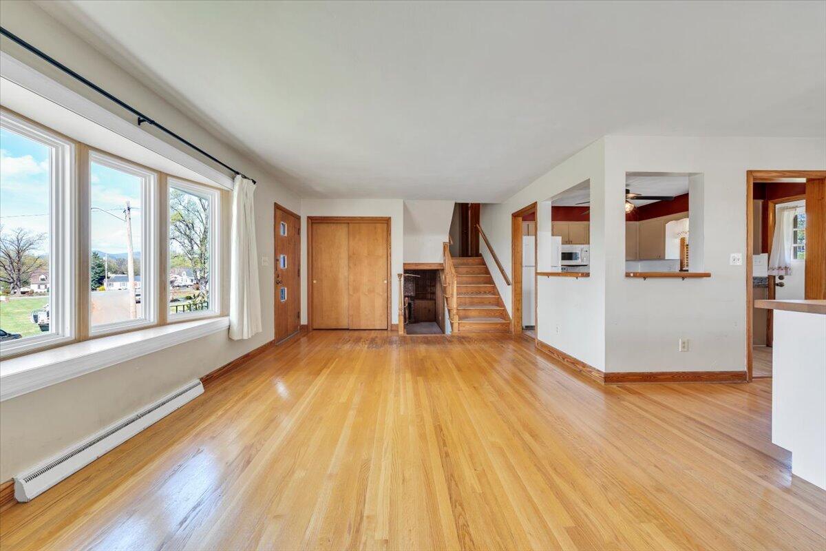2515 Northminster Road Northwest Roanoke, VA 24012 - Photo 6 of 54 a view of an empty room with wooden floor and a window