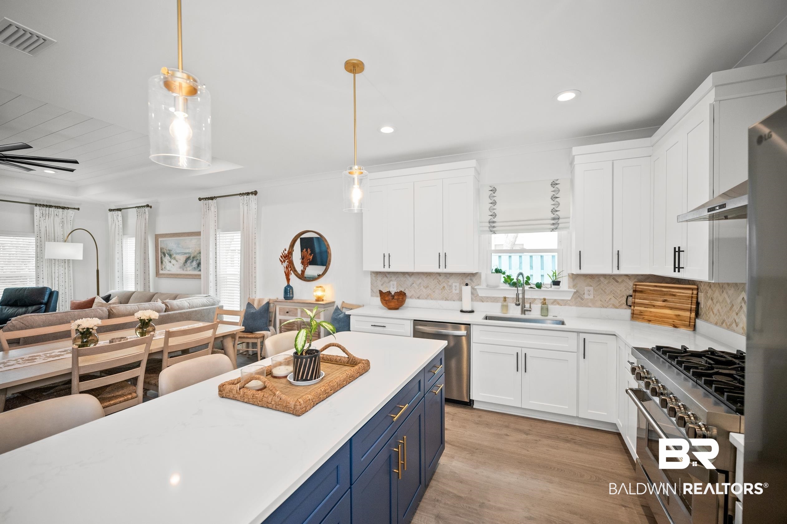 5501 Mobile Avenue Orange Beach, AL 36561 - Photo 39 of 40 Kitchen featuring blue cabinets, appliances with stainless steel finishes, white cabinets, open floor plan, and recessed lighting