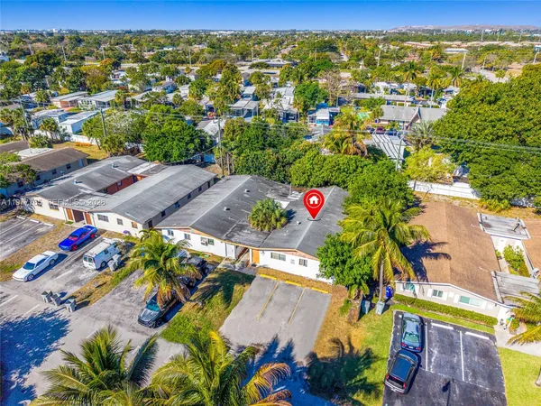 a view of a terrace with a table and chairs