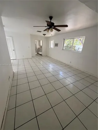 a view of an empty room and window