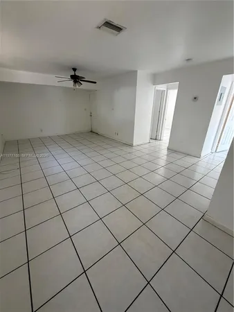 a view of an empty room and window