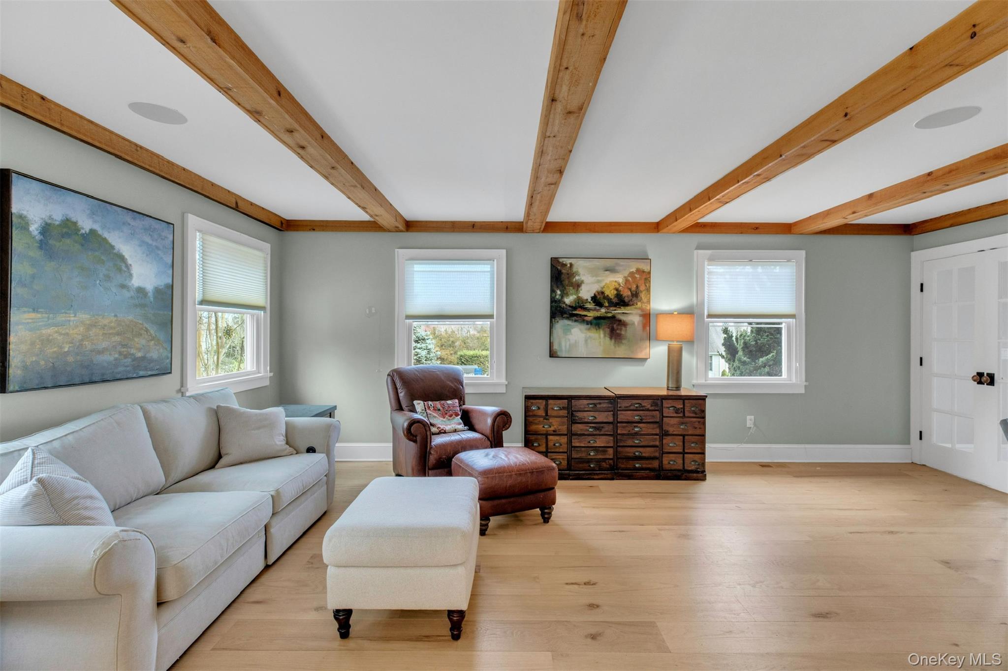 345 Colonial Road Southold, NY 11971 - Photo 8 of 43 a living room with furniture and a flat screen tv