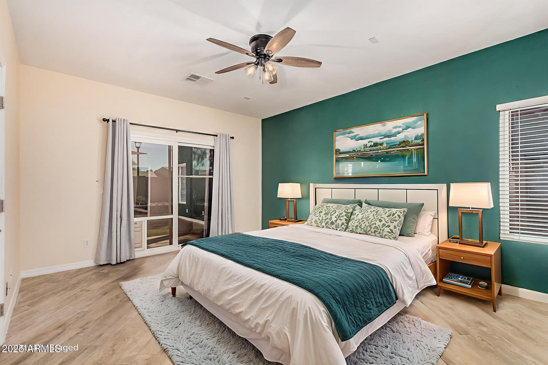 3047 East Fremont Road Phoenix, AZ 85042 - Photo 14 of 36 a bedroom with a bed and a large window