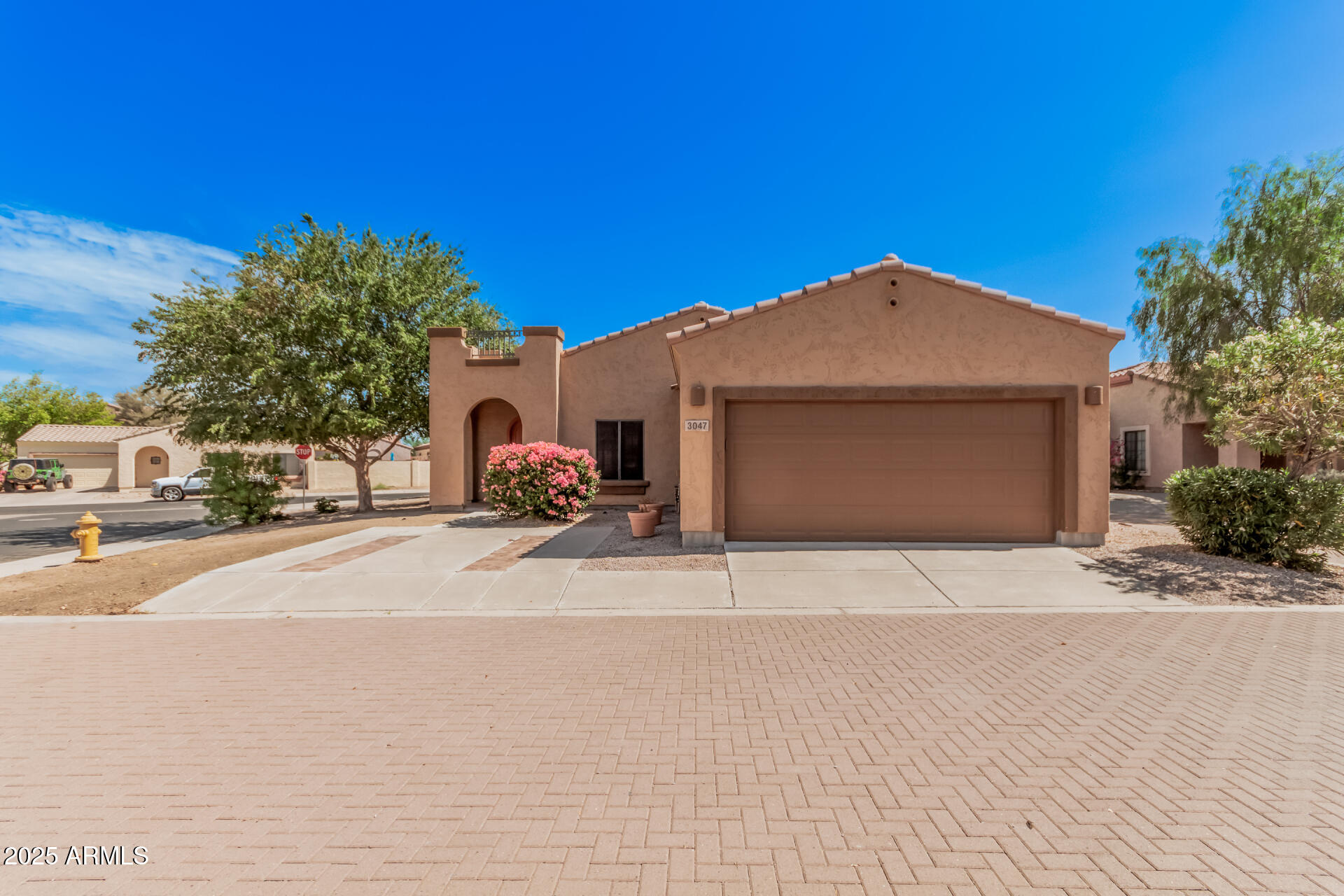 3047 East Fremont Road Phoenix, AZ 85042 - Photo 2 of 36 a front view of a house with a yard and garage