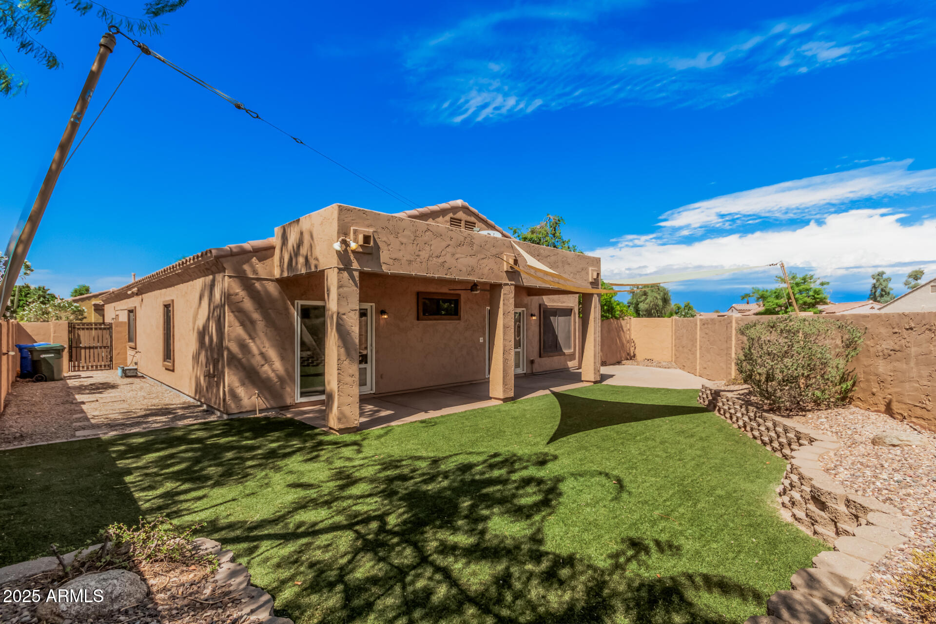 3047 East Fremont Road Phoenix, AZ 85042 - Photo 28 of 36 a view of a house with a yard