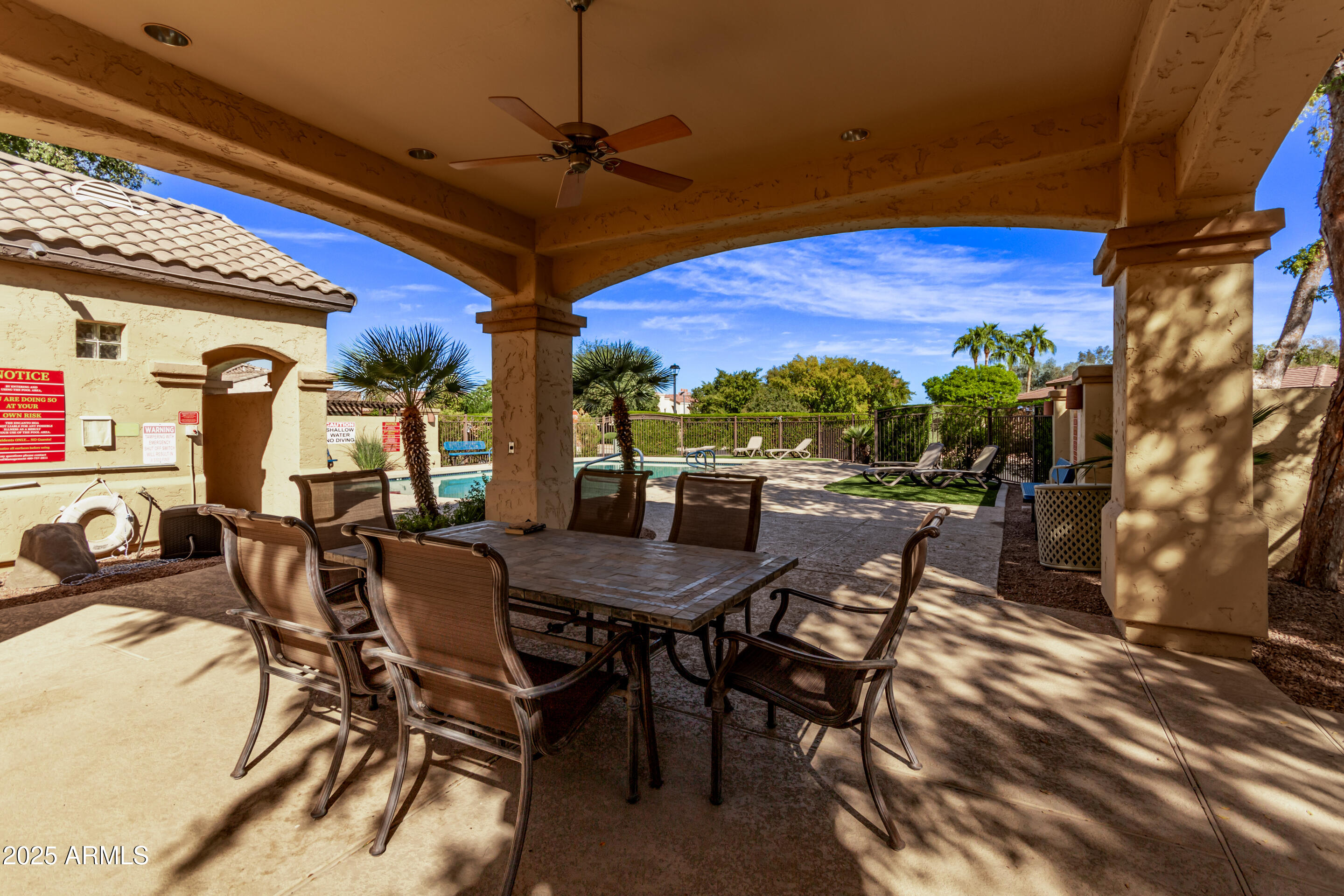 3047 East Fremont Road Phoenix, AZ 85042 - Photo 34 of 36 a view of a patio with a table and chairs