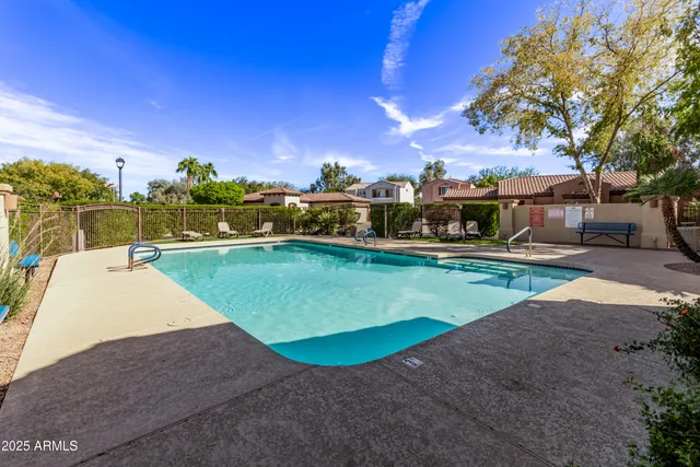 a view of a swimming pool with a yard