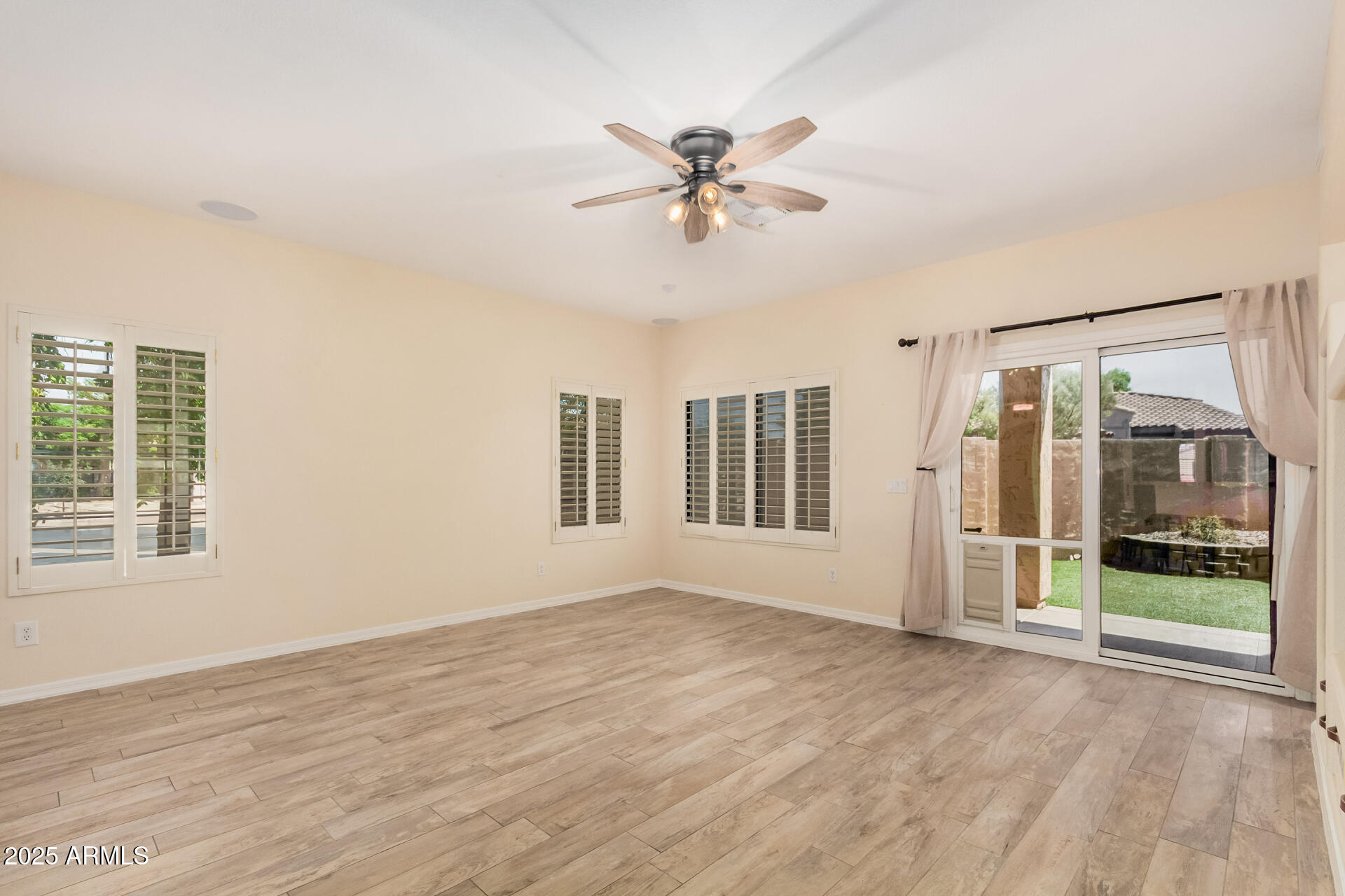 3047 East Fremont Road Phoenix, AZ 85042 - Photo 7 of 36 a view of an empty room with a window