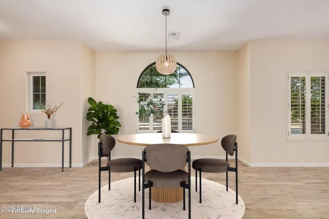 a dining room with furniture and window