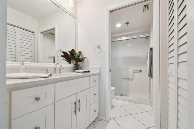 a white toilet sitting next to a bathroom