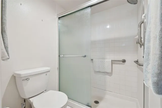 a en suite bathroom with double sink and a mirror