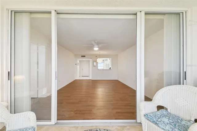 a front view of a building with a garden