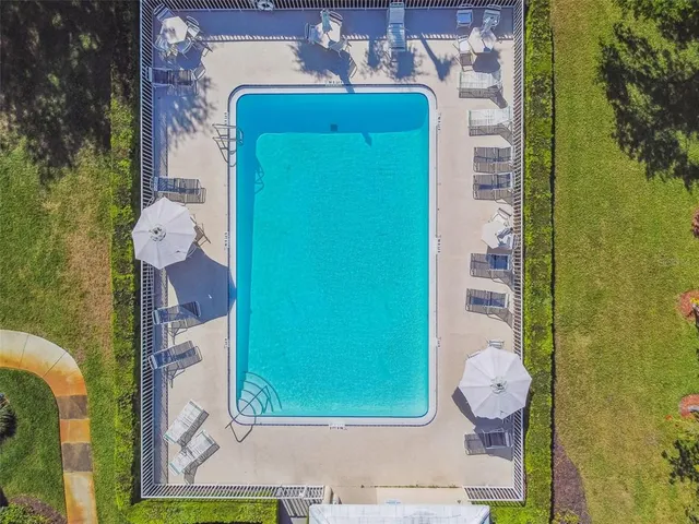 a dining room with furniture and a book shelf