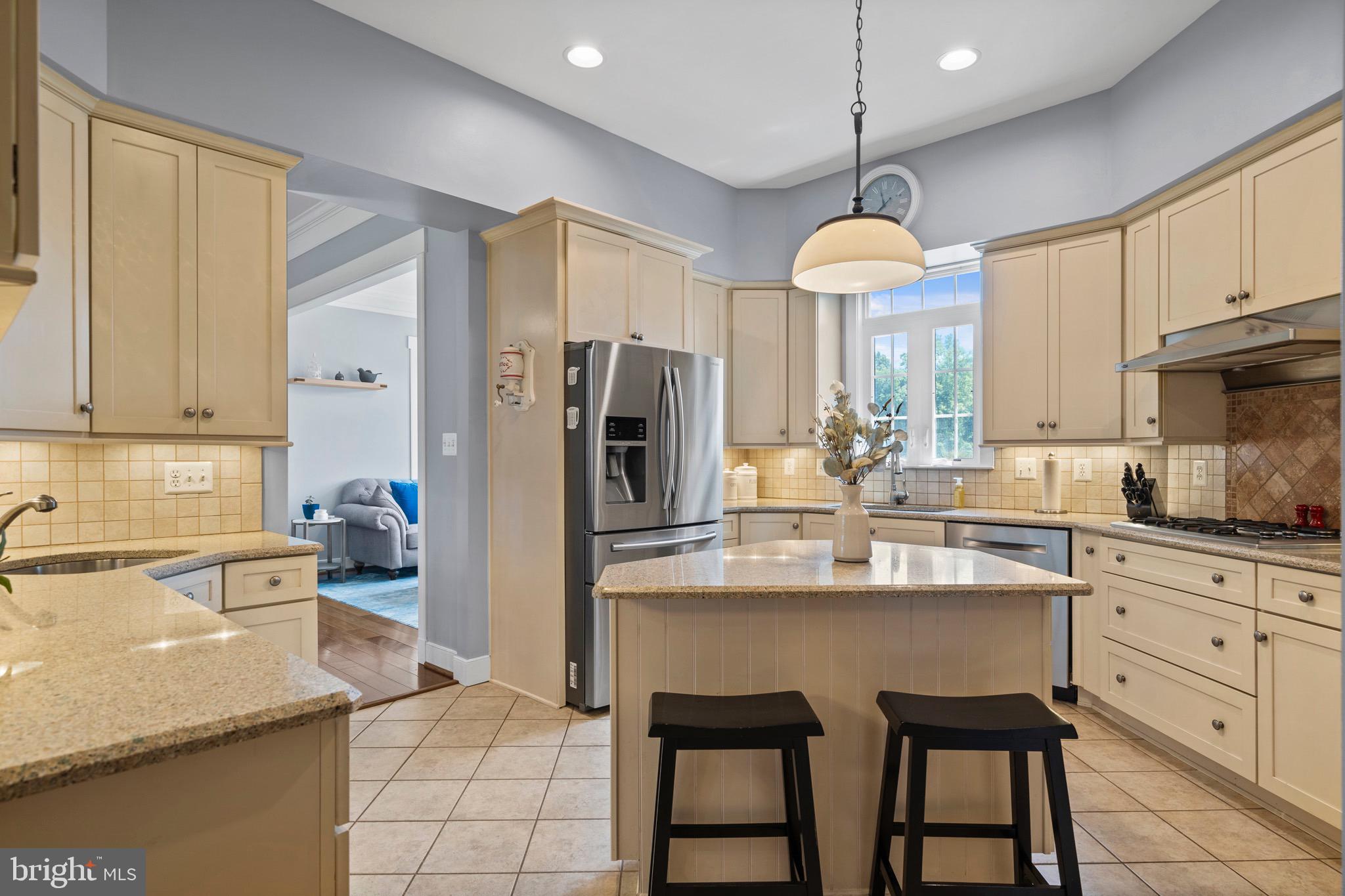 4160 Chaneyville Road Owings, MD 20736 - Photo 16 of 98 a kitchen with stainless steel appliances granite countertop a refrigerator a sink dishwasher a stove and white cabinets with wooden floor