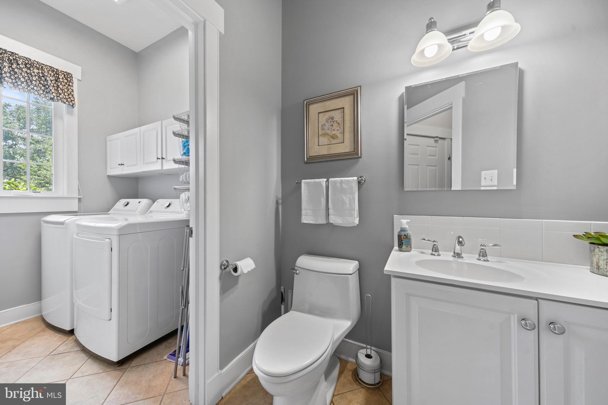 4160 Chaneyville Road Owings, MD 20736 - Photo 24 of 98 a bathroom with a toilet sink and mirror