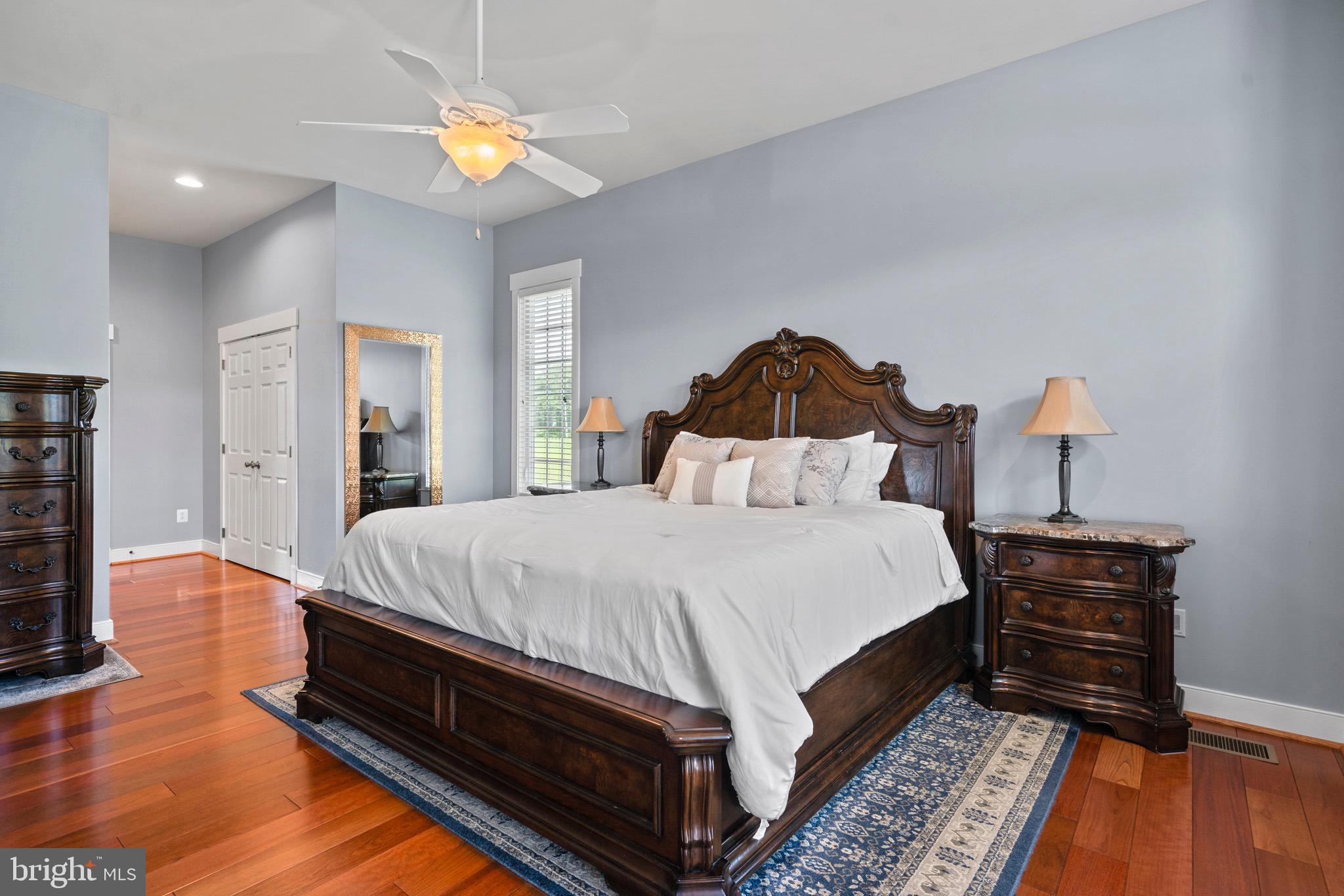 4160 Chaneyville Road Owings, MD 20736 - Photo 30 of 98 a spacious bedroom with a bed and a chandelier