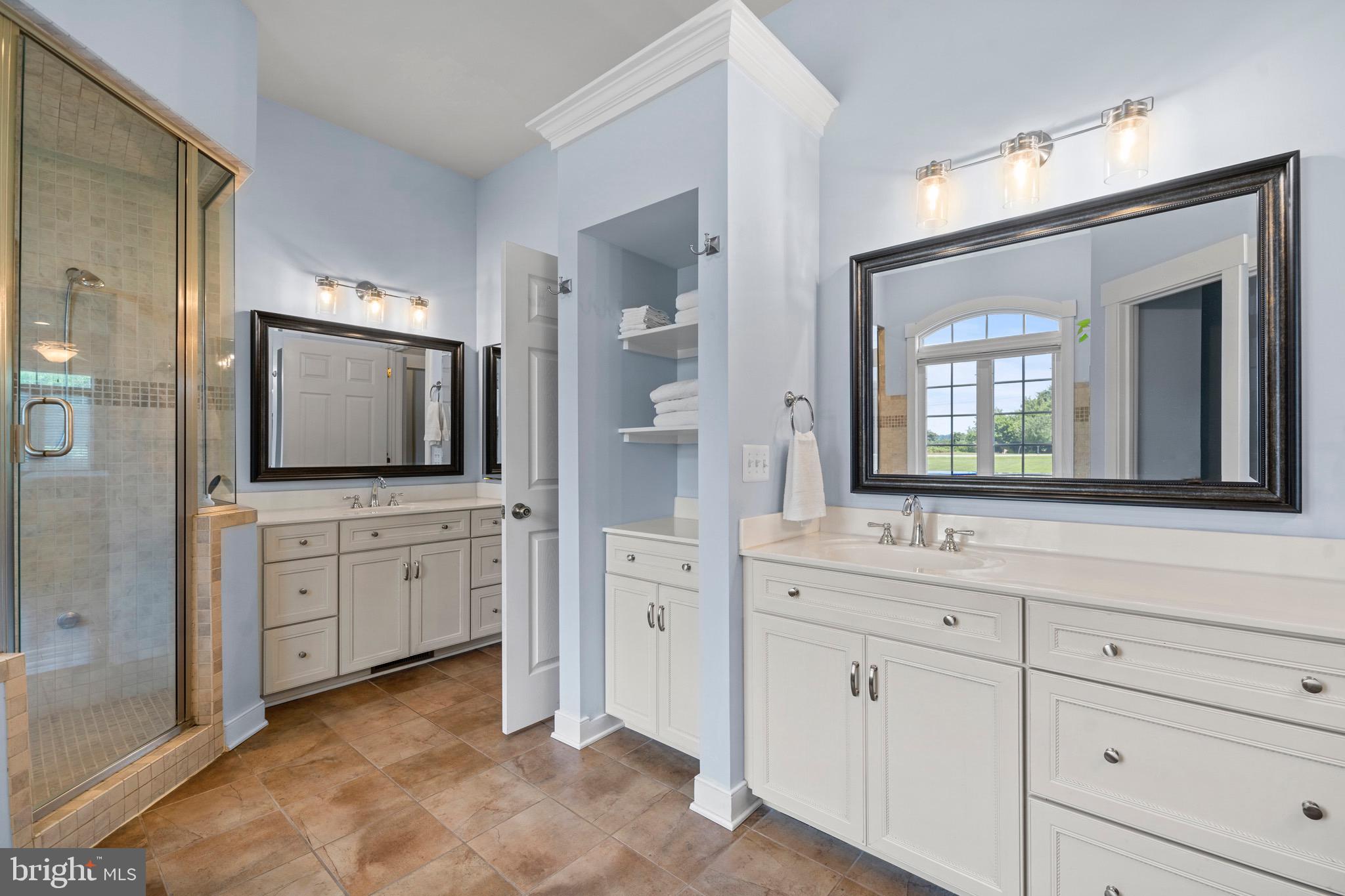 4160 Chaneyville Road Owings, MD 20736 - Photo 40 of 98 a spacious bathroom with double sink a large mirror and a bathtub
