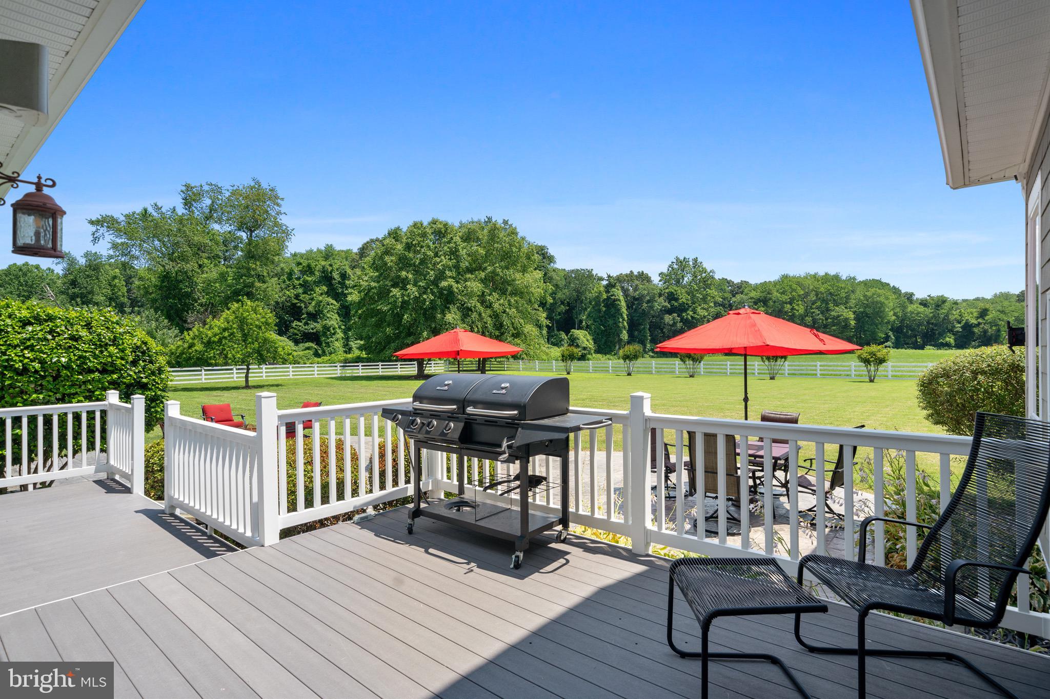 4160 Chaneyville Road Owings, MD 20736 - Photo 48 of 98 a view of a deck with furniture and a yard