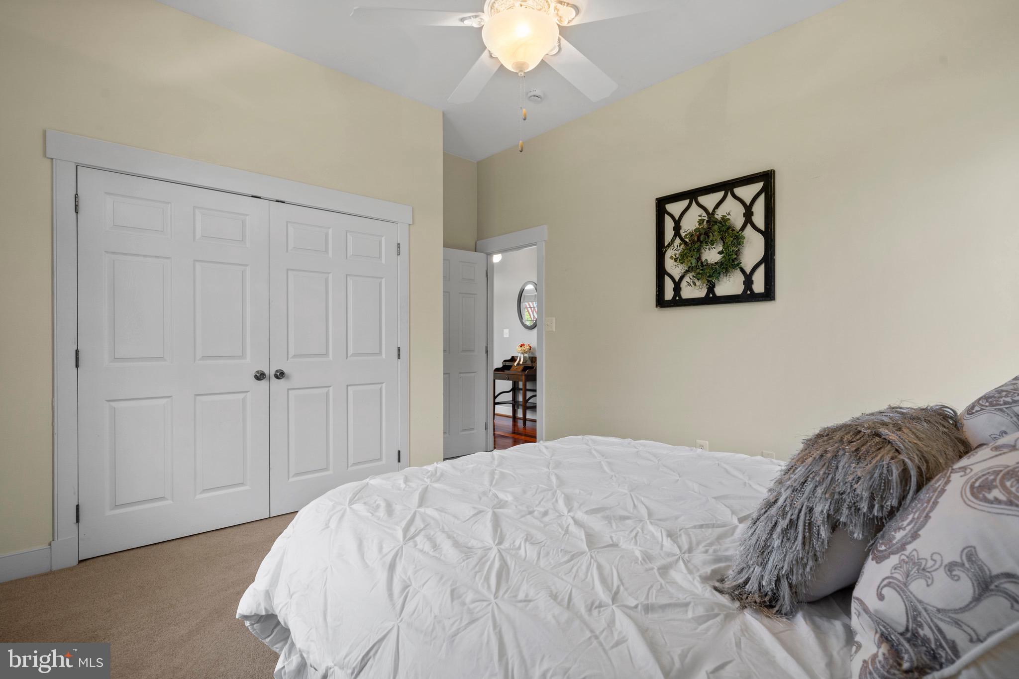 4160 Chaneyville Road Owings, MD 20736 - Photo 51 of 98 a bedroom with a bed and a chandelier