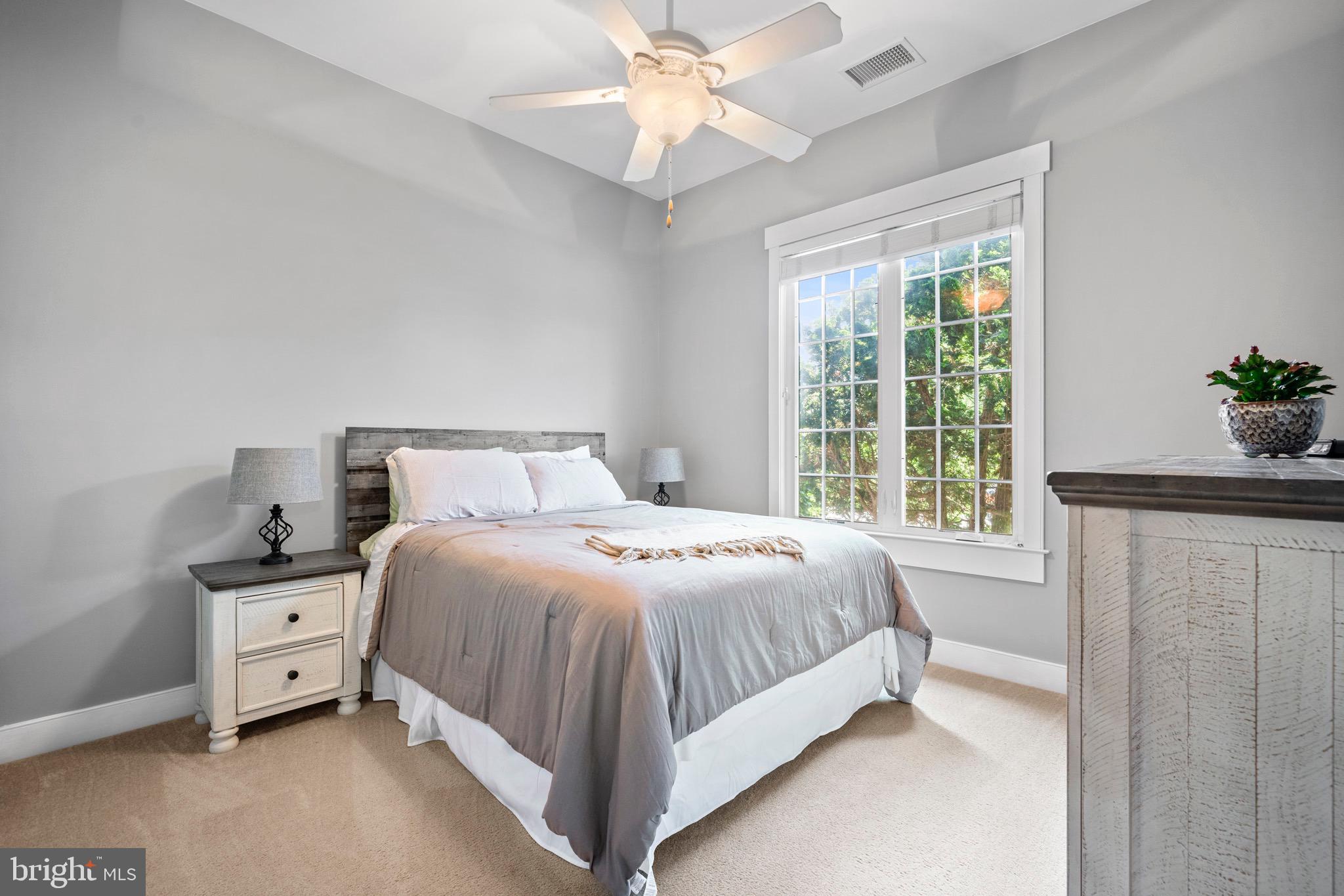 4160 Chaneyville Road Owings, MD 20736 - Photo 52 of 98 a bedroom with a bed and a chandelier