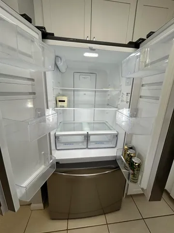 a view of wooden floor with a window