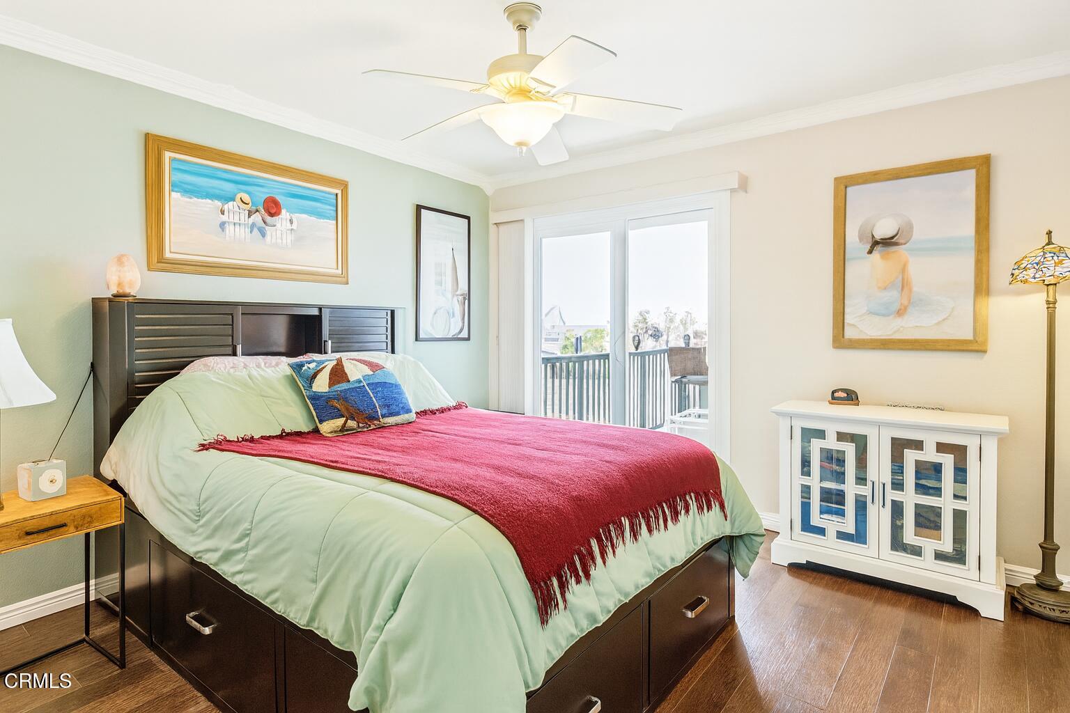 2901 Peninsula Road, Unit 337 Oxnard, CA 93035 - Photo 2 of 9 a bedroom with a bed and a chandelier