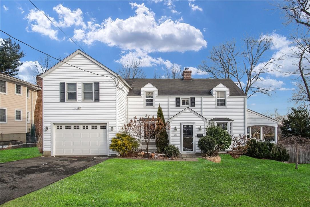 217 Beverly Road Scarsdale, NY 10583 - Photo 1 of 1 a front view of a house with a yard and garage