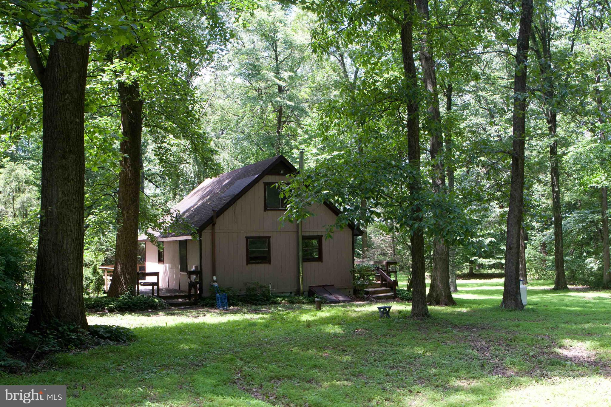 279 County Line Road Riegelsville, PA 18077 - Photo 17 of 24 a backyard of a house with yard table and chairs