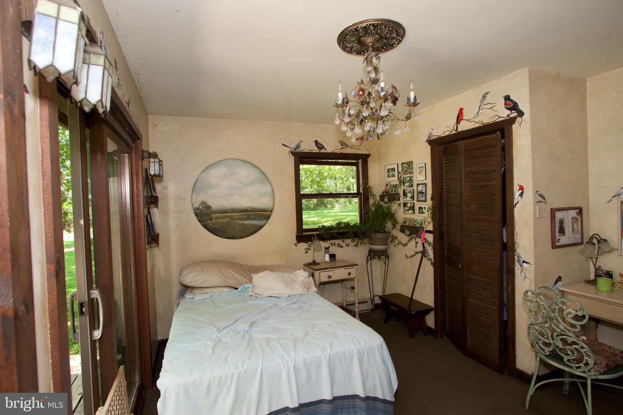 279 County Line Road Riegelsville, PA 18077 - Photo 9 of 24 a bedroom with a bed mirror and window