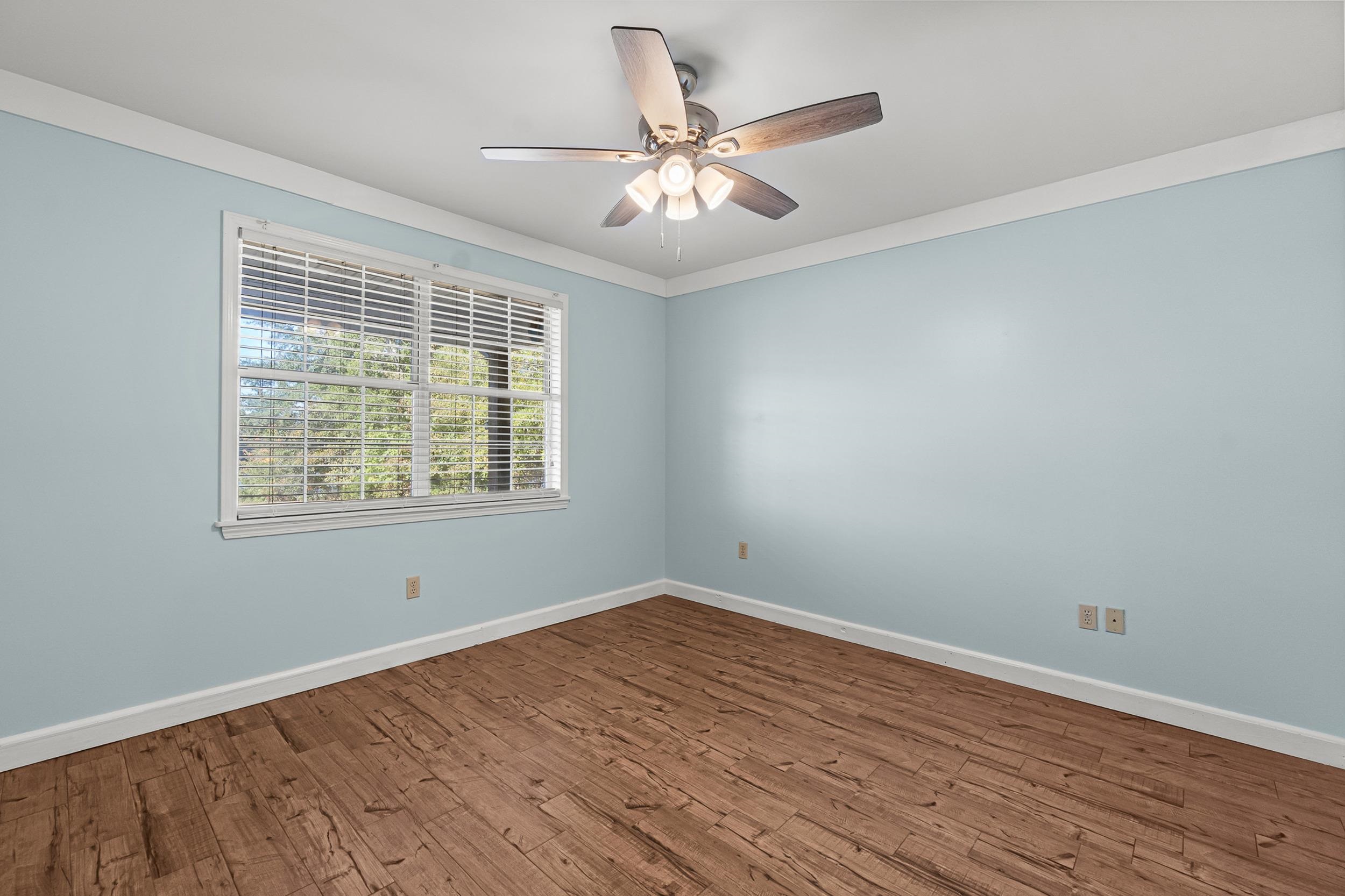 49 Cr 178 Road Iuka, MS 38852 - Photo 17 of 32 wooden floor in an empty room with a window