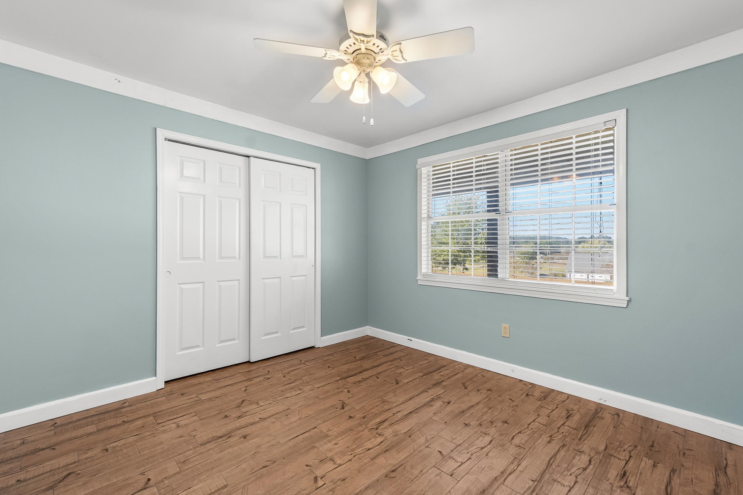 49 Cr 178 Road Iuka, MS 38852 - Photo 21 of 32 a view of an empty room with window and wooden floor